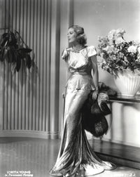 Loretta Young in shiny satin gown black and white photo print.