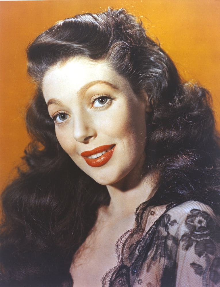 Loretta Young photo print featuring curly hairstyles and red lips in a lacy black dress.