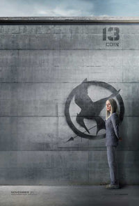 The Hunger Games: Mockingjay - Part 1 Movie Poster Print featuring iconic imagery.