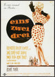 One, Two, Three Movie Poster Print showcasing vibrant colors and classic film theme.