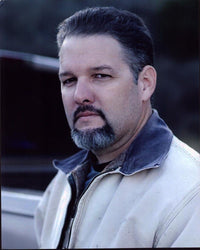 Britt Griffith close-up photo print in tan jacket.