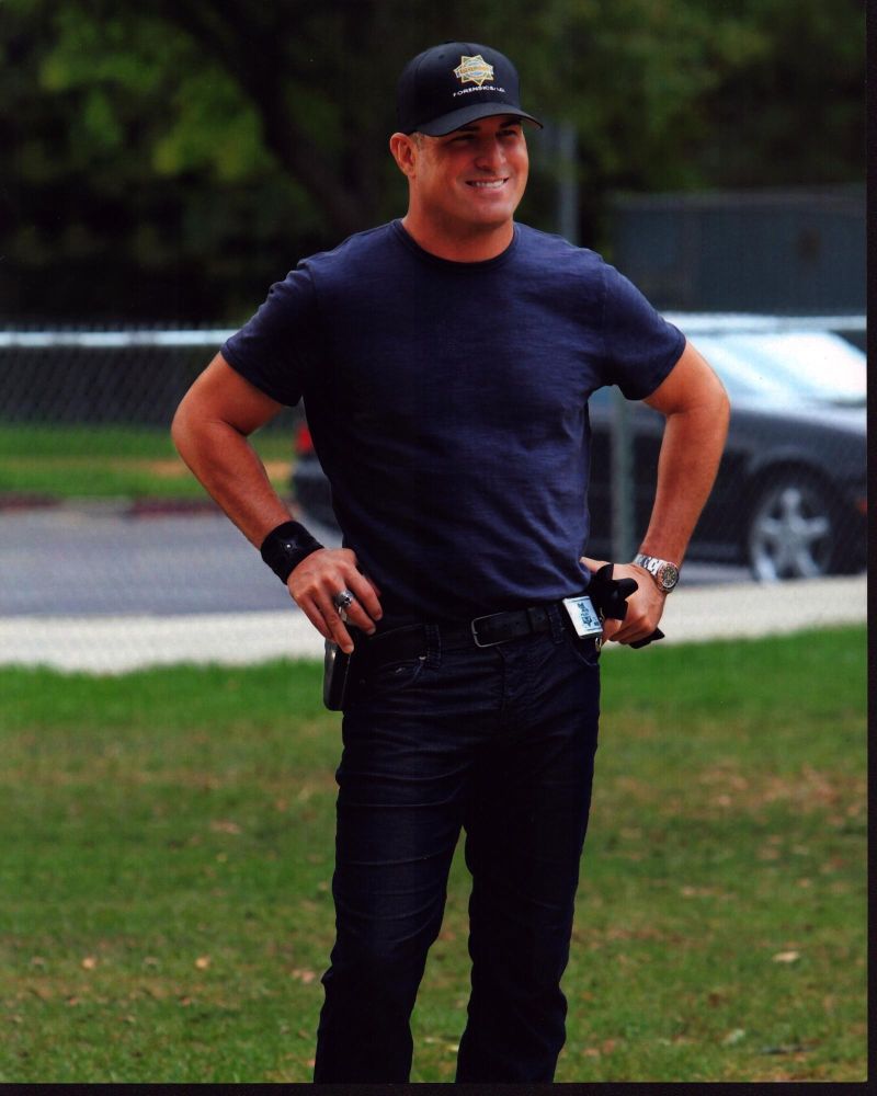 George Eads photo print on the set of CSI, hands on hips.