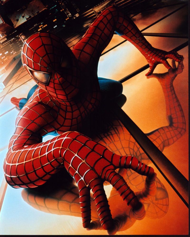 Spider-Man Climbing Up Skyscraper Photo Print showcasing the iconic superhero in action.