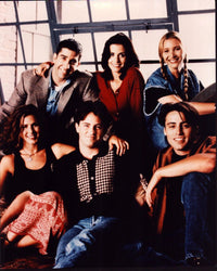 Friends cast photo print in front of windows, 8x10 size.