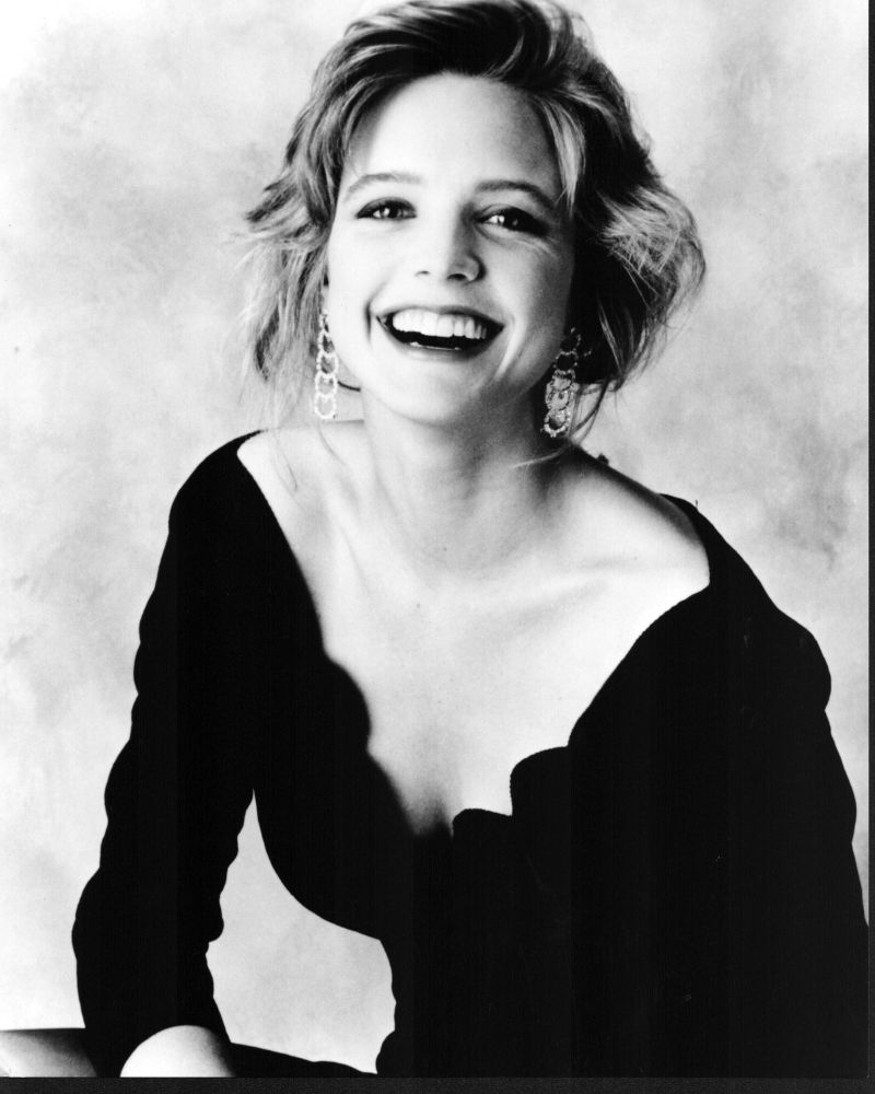 Courtney Thorne-Smith laughing in off shoulder dress photo print.