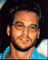 Val Kilmer close-up photo print in blue top and glasses.