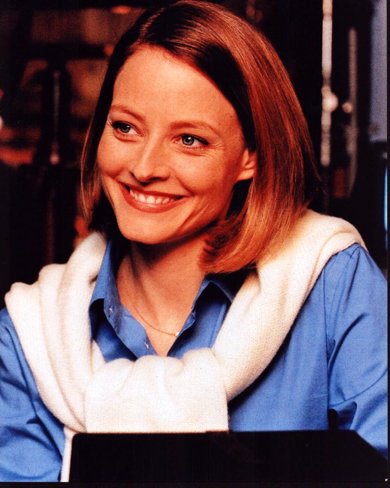 Jodie Foster photo print in blue top with white sweater over shoulders