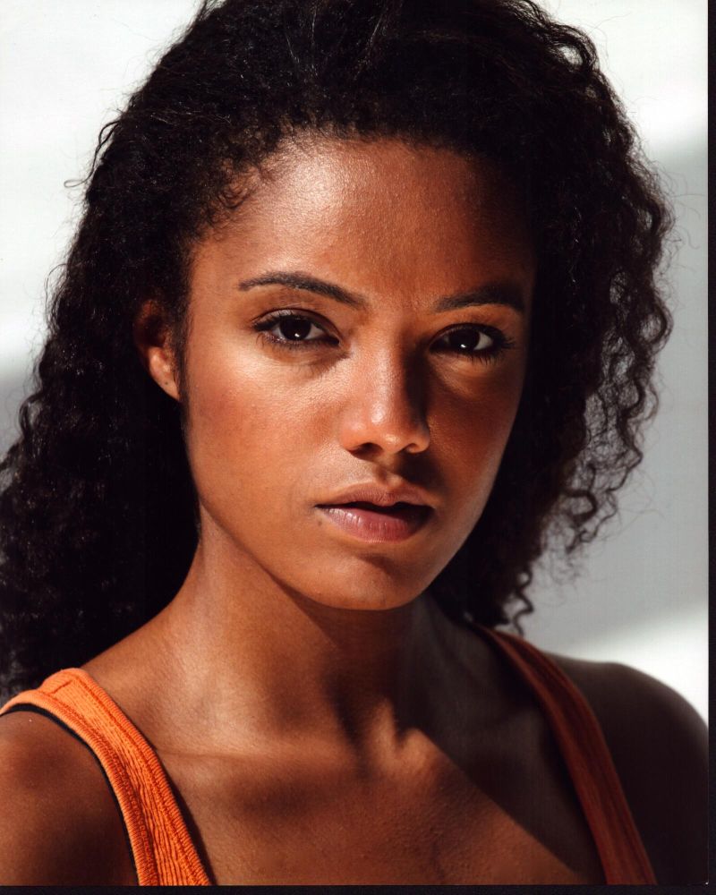 Maisie Richardson-Sellers photo print in orange tank top, stylish and vibrant.