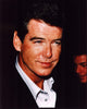 Close-up photo print of Pierce Brosnan in a black blazer and unbuttoned shirt.