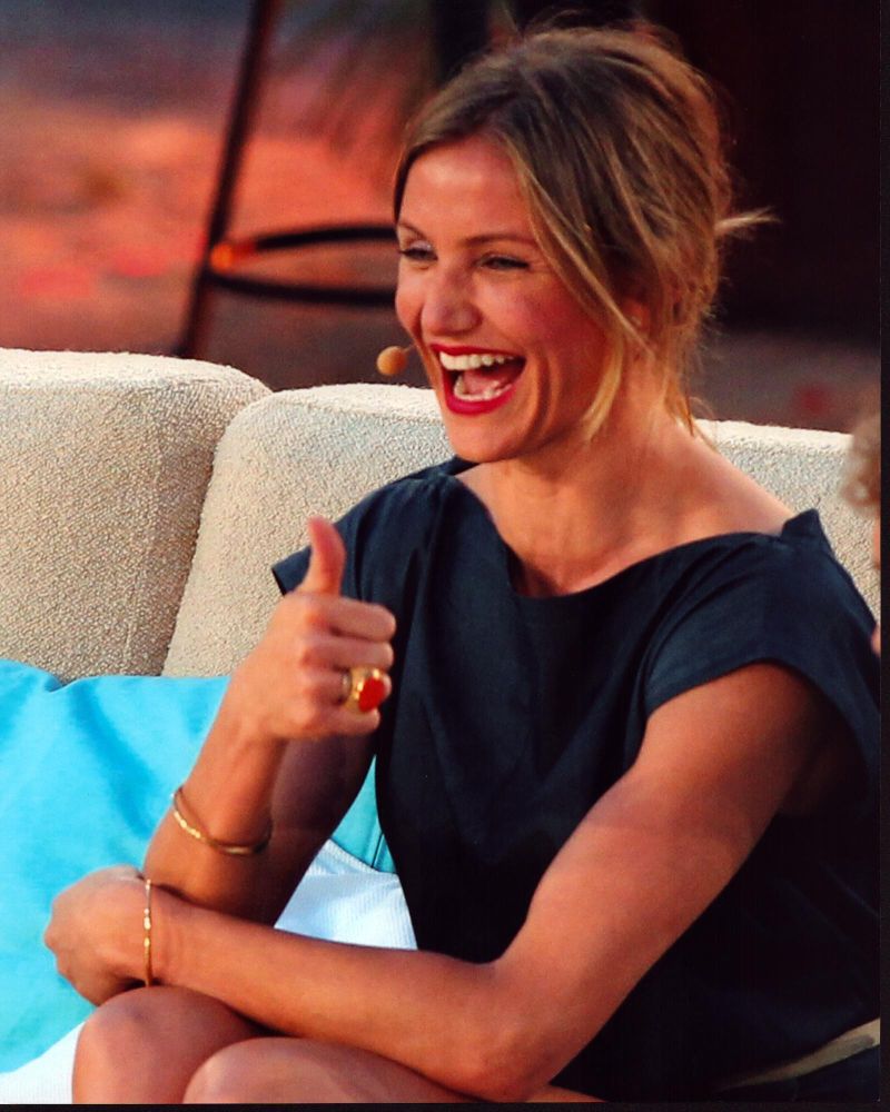 Cameron Diaz giving thumbs up with headset on photo print.
