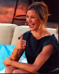 Cameron Diaz giving thumbs up with headset on photo print.