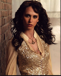 Jennifer Love Hewitt photo print in gold glitter vest and sheer sleeves.