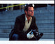 Carmine Giovinazzo on the set of CSI: NY, photo print in brown blazer with camera.