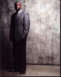 Steve Harris photo print in gray suit, iconic rock musician.