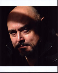 Mark Ryan headshot in shadows photo print showcasing dramatic photography.