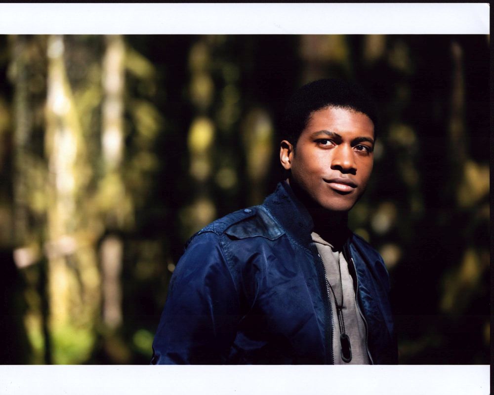 Eli Goree wearing a blue jacket in the woods photo print