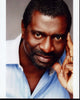 Afemo Omilami headshot photo print in blue top