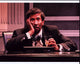 Reg E. Cathey holding head in hands photo print.