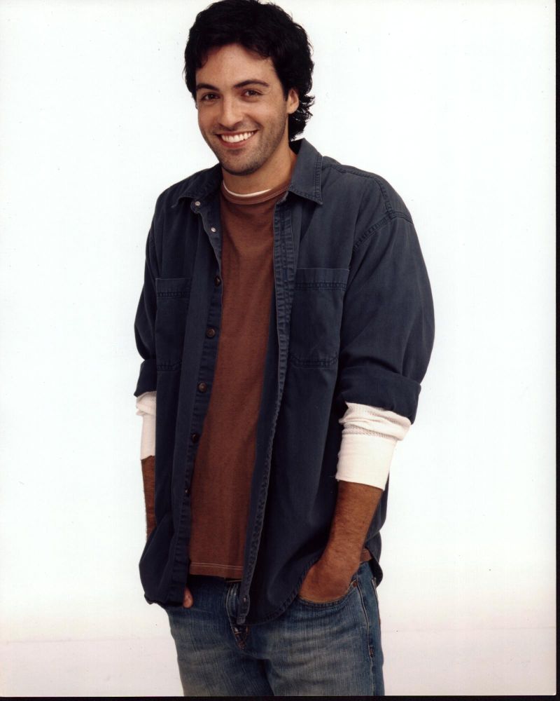 Ben Feldman photo print with hands in pockets and layered shirts.