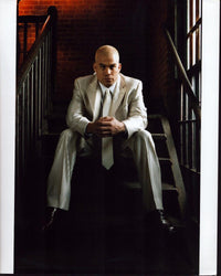 Tito Ortiz photo print in white striped suit on stairs