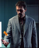Hugh Laurie photo print tossing a pill bottle, available in multiple sizes.