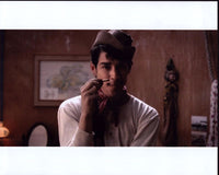 Vlscar Jaenada holding a cigarette in a Cantinflas photo print.