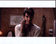 Vlscar Jaenada holding a cigarette in a Cantinflas photo print.