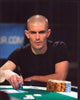 Gus Hansen holding chips during a poker game photo print.