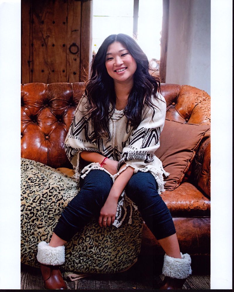 Jenna Ushkowitz cozy photo print on leather couch