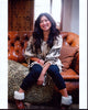 Jenna Ushkowitz cozy photo print on leather couch