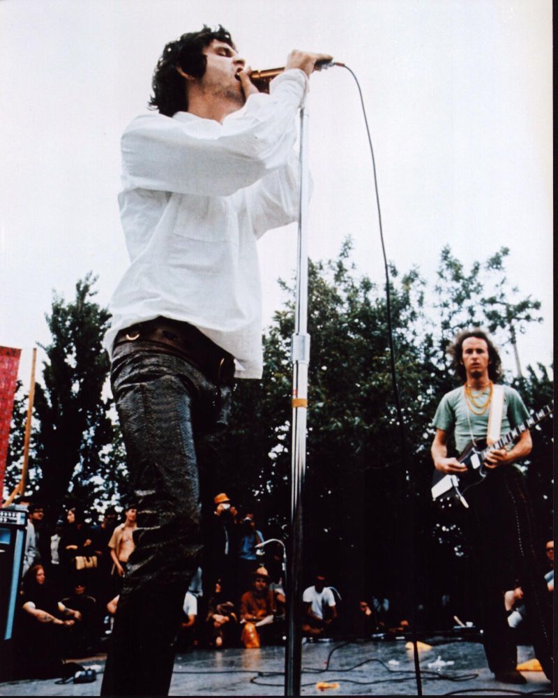 Jim Morrison live performance photo print showcasing the iconic rock star on stage.