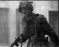 Donnie Wahlberg yelling with gun in Band of Brothers black and white photo print.