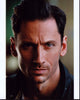 Derek Wilson headshot photo print in black jacket.