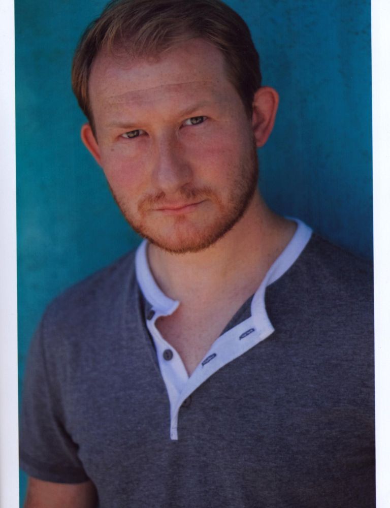 Adam Wylie in unbuttoned gray shirt photo print