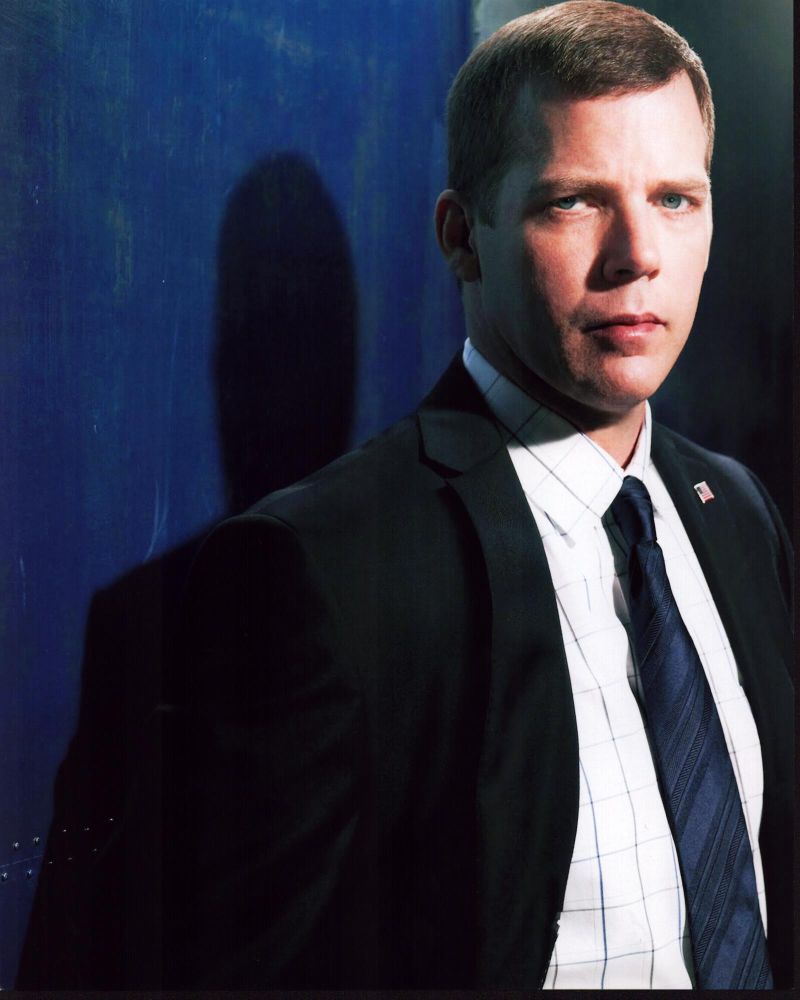 Tim Griffin photo print in a suit with blue tie, elegant and stylish.