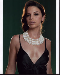 Vanessa Ferlito photo print in black top with multiple pearl necklaces.