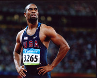 Tyson Gay at the Olympics photo print with hands on hips.