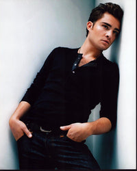 Ed Westwick leaning against a wall in a black top photo print