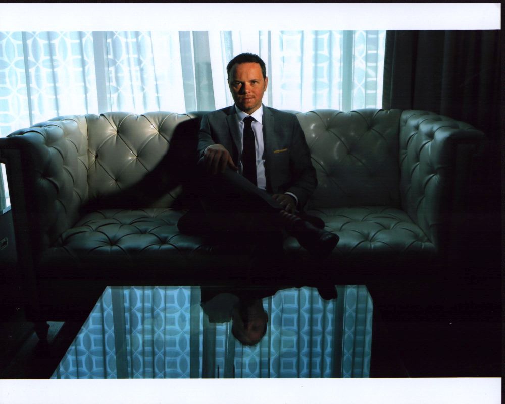 Noah Hawley On Leather Couch Photo Print, stylish photography for home decor