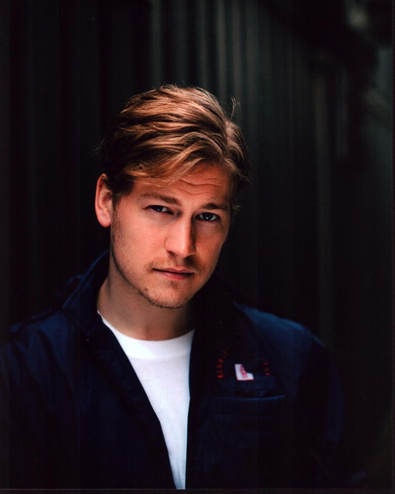 Gavin Stenhouse photo print in dark blue jacket, stylish portrait.