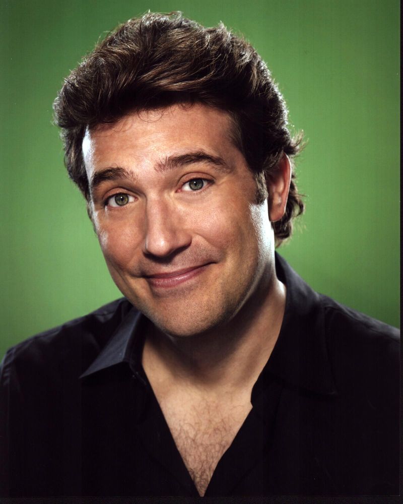 Craig Bierko headshot photo print with green background.