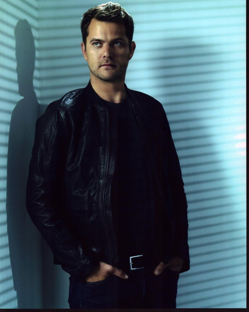 Joshua Jackson photo print in leather jacket with hands in pockets.