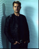 Joshua Jackson photo print in leather jacket with hands in pockets.