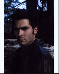 Photo print of Tyler Hoechlin in a black leather jacket, showcasing his style.