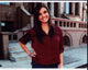 Rebecca Black in a red top with hand on hip photo print.