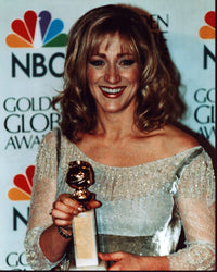 Edie Falco holding Golden Globe Award in silver dress photo print