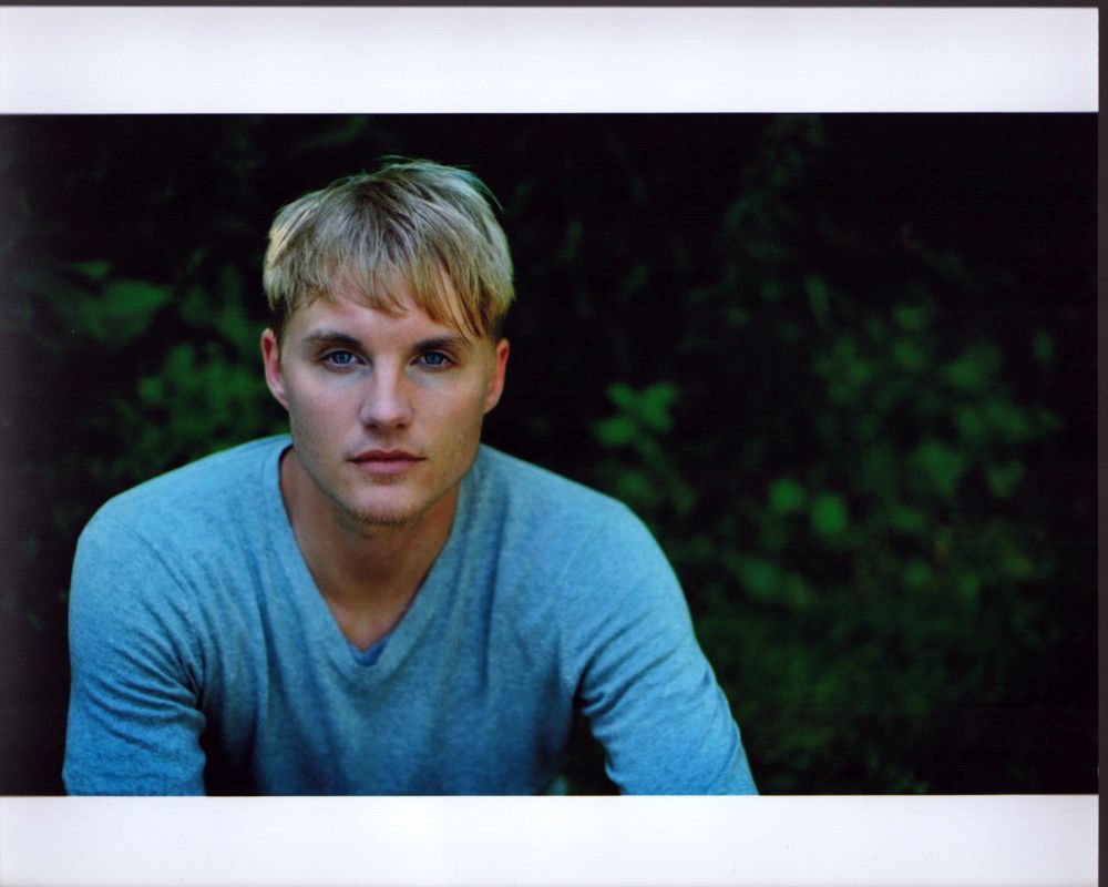 Toby Hemingway in Gray Sweater Photo Print showcasing style and serenity.