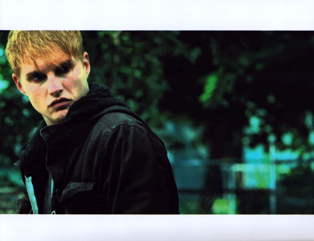 Toby Hemingway Looking Over Shoulder in Black Jacket Photo Print