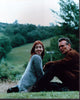 Alyson Hannigan and Anthony Head sitting in grass on the set of Buffy the Vampire Slayer photo print
