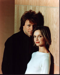 Jon Bon Jovi and Calista Flockhart leaning on a wall photo print.